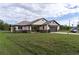 One-story house with a large backyard and landscaping at 2972 Lake Saxon Dr, Land O Lakes, FL 34639
