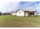 Rear view of a single-Gathering home showcasing a covered patio at 2972 Lake Saxon Dr, Land O Lakes, FL 34639