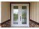 Double front doors with elegant glass inserts at 2972 Lake Saxon Dr, Land O Lakes, FL 34639