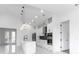 Open concept kitchen with white cabinets, stainless steel appliances and a breakfast bar at 2972 Lake Saxon Dr, Land O Lakes, FL 34639