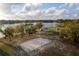 Sand volleyball court and gazebos near the lake at 2972 Lake Saxon Dr, Land O Lakes, FL 34639