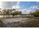 Sand volleyball court with pavilions and lake views at 2972 Lake Saxon Dr, Land O Lakes, FL 34639