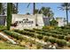 Welcoming Esplanade entrance sign amid lush landscaping and palm trees at 29800 Cassino Ct, Wesley Chapel, FL 33543