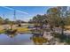 Aerial view of home on lakefront property with private dock at 3050 Maple Trce, Tarpon Springs, FL 34688