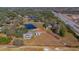 Aerial view showing home, pool, barn, pond and large lot at 3050 Maple Trce, Tarpon Springs, FL 34688
