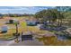 Aerial view of a home on acreage with a pond, barn, and private dock at 3050 Maple Trce, Tarpon Springs, FL 34688