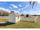 Property features a barn, shed, and white rail fencing at 3050 Maple Trce, Tarpon Springs, FL 34688