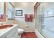 Bathroom with a large shower and terracotta tile floors at 3050 Maple Trce, Tarpon Springs, FL 34688