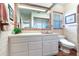 Clean bathroom with updated vanity and terracotta tile floor at 3050 Maple Trce, Tarpon Springs, FL 34688