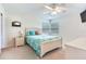 Bedroom with a queen-size bed and plenty of natural light at 3050 Maple Trce, Tarpon Springs, FL 34688