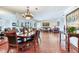 Large dining room with terracotta tile floors and a view of the living room at 3050 Maple Trce, Tarpon Springs, FL 34688