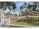 Ornate entrance gate to The Golf View Ranch at 3050 Maple Trce, Tarpon Springs, FL 34688