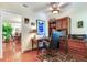 Home office features built-in wooden shelving and a large desk at 3050 Maple Trce, Tarpon Springs, FL 34688