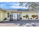 Inviting entrance with double doors and ornate iron gates at 3050 Maple Trce, Tarpon Springs, FL 34688