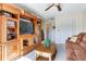 Living room with built-in wooden entertainment center at 3050 Maple Trce, Tarpon Springs, FL 34688