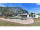 Large, inviting pool with surrounding patio at 3050 Maple Trce, Tarpon Springs, FL 34688