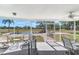 Relaxing screened porch overlooking pool and tranquil landscape at 3050 Maple Trce, Tarpon Springs, FL 34688