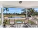 Enjoy the view from this screened porch with pool access at 3050 Maple Trce, Tarpon Springs, FL 34688