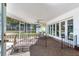 Bright and airy screened porch with access to backyard at 3050 Maple Trce, Tarpon Springs, FL 34688