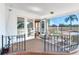 Spacious screened porch offering views of the backyard at 3050 Maple Trce, Tarpon Springs, FL 34688