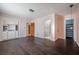 Bright bedroom featuring built-in shelving and hardwood floors at 3212 W Arch St, Tampa, FL 33607