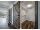 Walk-in closet with wood flooring and barn door entry at 3212 W Arch St, Tampa, FL 33607