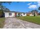 Updated home with a large driveway and spacious yard at 3517 Kingsbury Dr, Holiday, FL 34691