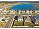 Aerial view of homes and a lake at 38296 Sonnet Landing Ave, Zephyrhills, FL 33540