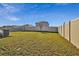 Spacious grassy backyard with a privacy fence at 38296 Sonnet Landing Ave, Zephyrhills, FL 33540