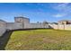 Grass backyard with privacy fence at 38296 Sonnet Landing Ave, Zephyrhills, FL 33540