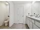 Main bathroom with double vanity and toilet at 38296 Sonnet Landing Ave, Zephyrhills, FL 33540