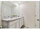 Clean bathroom with double vanity and updated fixtures at 38296 Sonnet Landing Ave, Zephyrhills, FL 33540