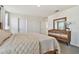 Well-lit bedroom with a bed and dresser at 38296 Sonnet Landing Ave, Zephyrhills, FL 33540