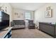 Bright Bedroom with crib, changing table, and comfortable seating at 38296 Sonnet Landing Ave, Zephyrhills, FL 33540