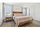 Bright bedroom with a comfortable bed and nightstand at 38296 Sonnet Landing Ave, Zephyrhills, FL 33540