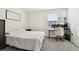 Bright bedroom with workspace and a comfortable bed at 38296 Sonnet Landing Ave, Zephyrhills, FL 33540