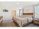 Spacious bedroom with a king-size bed and ensuite bathroom at 38296 Sonnet Landing Ave, Zephyrhills, FL 33540