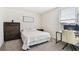 Well-lit bedroom with workspace and ample closet space at 38296 Sonnet Landing Ave, Zephyrhills, FL 33540