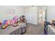 bedroom with dollhouse and plush toys at 38296 Sonnet Landing Ave, Zephyrhills, FL 33540
