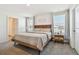 Main bedroom with wood bed frame and neutral decor at 38296 Sonnet Landing Ave, Zephyrhills, FL 33540