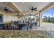 Community patio with tables, chairs, and ceiling fans at 38296 Sonnet Landing Ave, Zephyrhills, FL 33540