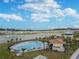 Community pool with lounge area and cabana at 38296 Sonnet Landing Ave, Zephyrhills, FL 33540