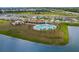 Community pool with playground nearby at 38296 Sonnet Landing Ave, Zephyrhills, FL 33540