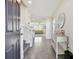 Bright foyer with tile floors, console table, and view to living room at 38296 Sonnet Landing Ave, Zephyrhills, FL 33540