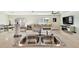 Modern kitchen island with double sink overlooking living room at 38296 Sonnet Landing Ave, Zephyrhills, FL 33540