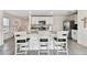 Spacious kitchen with island, stainless steel appliances, and white cabinets at 38296 Sonnet Landing Ave, Zephyrhills, FL 33540