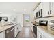Clean kitchen with stainless steel appliances and white shaker cabinets at 38296 Sonnet Landing Ave, Zephyrhills, FL 33540