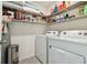 Laundry room with washer, dryer, and shelving at 38296 Sonnet Landing Ave, Zephyrhills, FL 33540