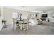 Open living and dining area with large windows and neutral colors at 38296 Sonnet Landing Ave, Zephyrhills, FL 33540