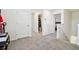 Upstairs hall with bathroom and bedroom access at 38296 Sonnet Landing Ave, Zephyrhills, FL 33540